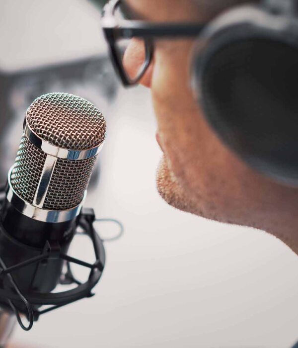 Professional speaker recording a live podcast for his channel, communication and media concept